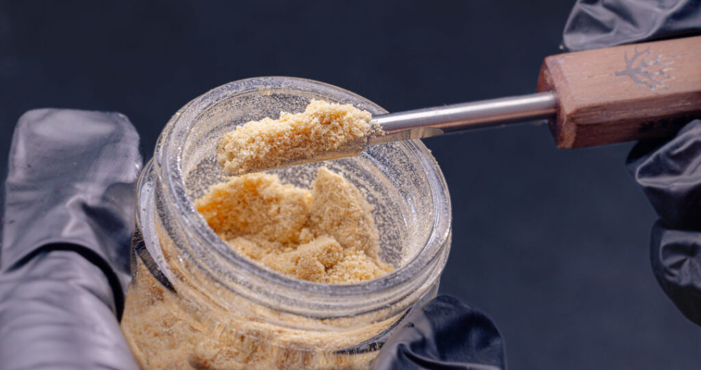 Close-up of premium whole melt extract with crystalline trichomes, highlighting purity and full-spectrum cannabis quality