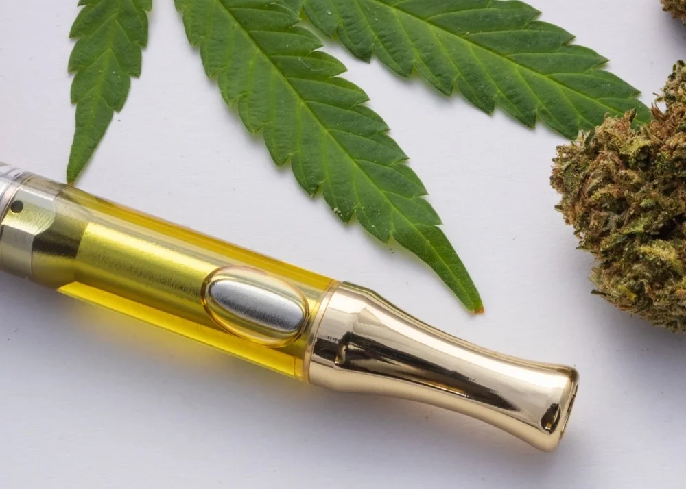 Cannabis vape pen with 510-thread cartridge flat lay for smooth vaping experience